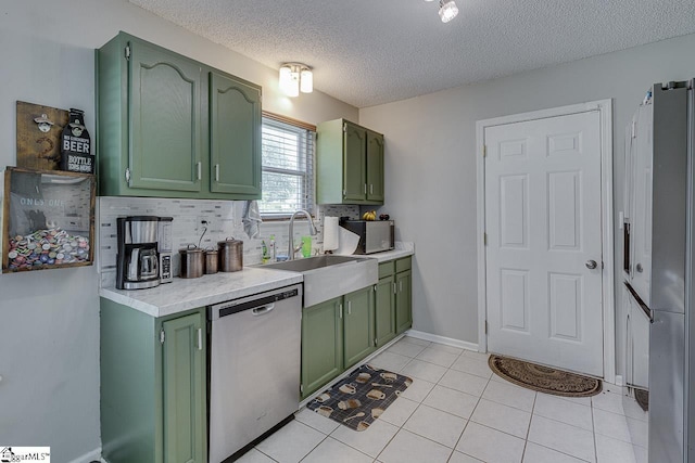 221 Twin Falls Dr, Simpsonville, SC 29680 - kitchen featuring green cabinets, stainless steel dishwasher, a sink, light countertops, and a textured ceiling