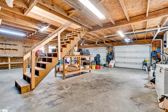 garage featuring a workshop area and a garage door opener