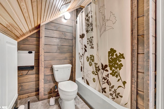 bathroom featuring vaulted ceiling, wood walls, toilet, wood ceiling, and shower / bath combination with curtain