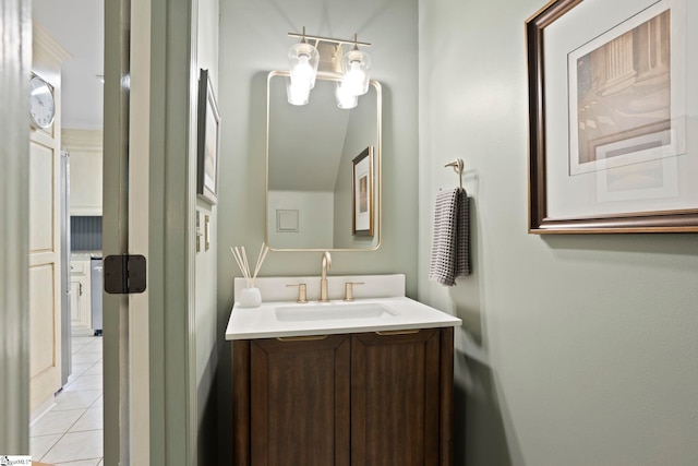 bathroom featuring tile patterned flooring and vanity