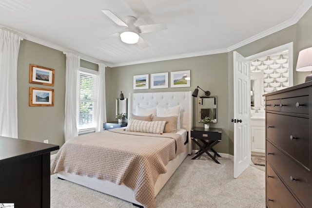 bedroom featuring light colored carpet, crown molding, a ceiling fan, connected bathroom, and baseboards