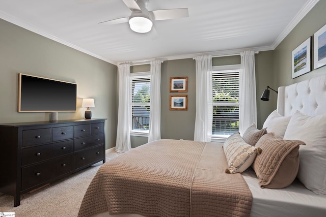 bedroom with ornamental molding, light colored carpet, and ceiling fan