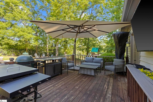 wooden terrace featuring an outdoor hangout area, outdoor dining space, and view of scattered trees