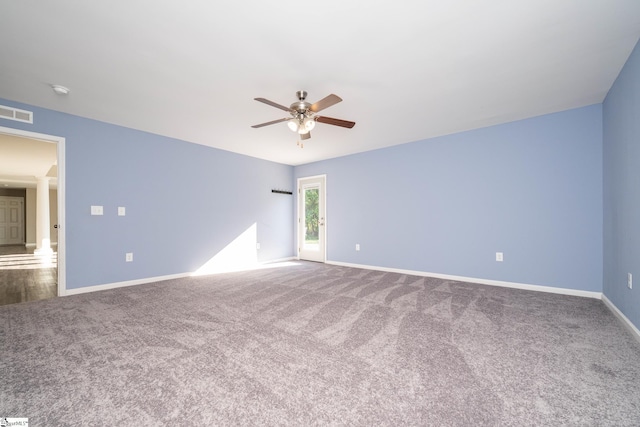 221 Wilsontown Rd, Laurens, SC 29360 - empty room featuring ceiling fan, carpet, ornate columns, and baseboards