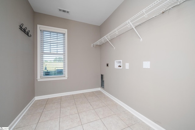 221 Wilsontown Rd, Laurens, SC 29360 - laundry room featuring hookup for an electric dryer, washer hookup, light tile patterned flooring, and baseboards