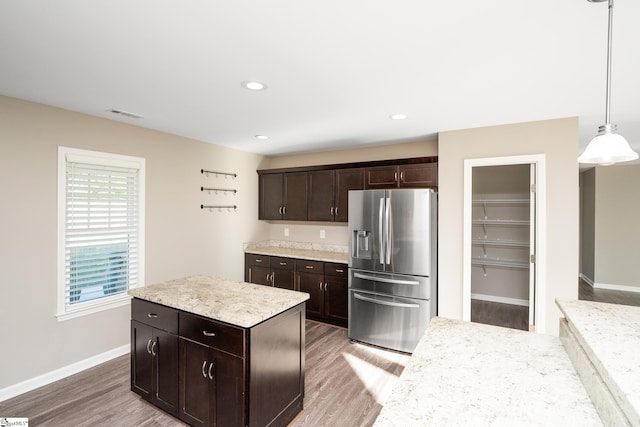 221 Wilsontown Rd, Laurens, SC 29360 - kitchen with stainless steel fridge with ice dispenser, light wood-style floors, dark brown cabinets, light countertops, and recessed lighting