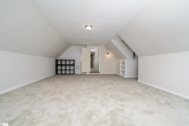 221 Wilsontown Rd, Laurens, SC 29360 - additional living space featuring light colored carpet, lofted ceiling, and baseboards