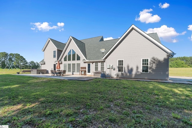 221 Wilsontown Rd, Laurens, SC 29360 - rear view of property featuring a patio, a yard, and a shingled roof