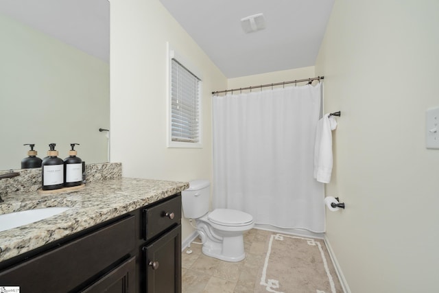 full bathroom with vanity, toilet, baseboards, and tile patterned floors
