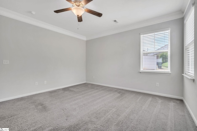 unfurnished room with crown molding, a ceiling fan, carpet, and baseboards