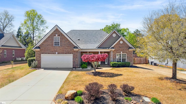 traditional-style home with an attached garage, brick siding, driveway, a shingled roof, and central air condition unit
