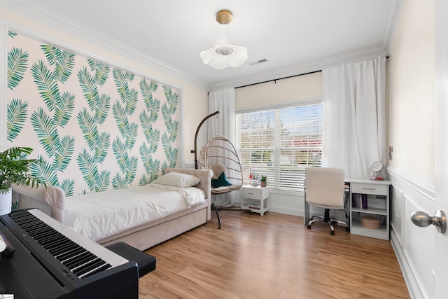 bedroom with crown molding, light wood finished floors, baseboards, and an office area