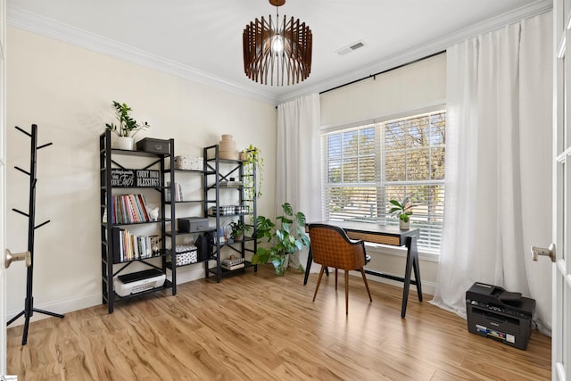 home office with crown molding, light wood finished floors, and baseboards