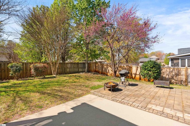 view of patio / terrace with an outdoor fire pit