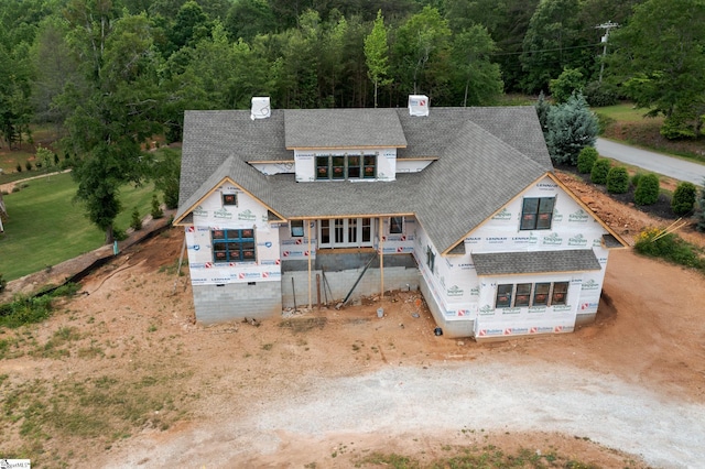 100 Pinelands Pl, Travelers Rest, SC 29690 - view of front of home with roof with shingles, a chimney, and a forest view