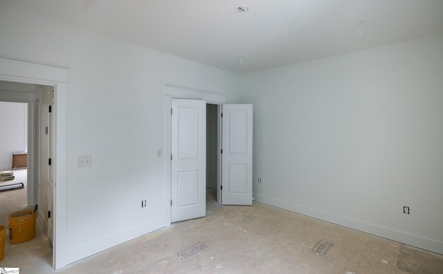 unfurnished bedroom with baseboards