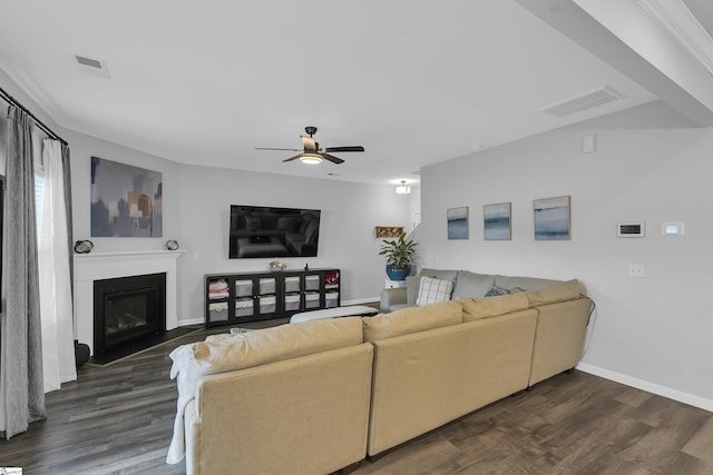 110 Strongridge Trl, Simpsonville, SC 29681 - living room with baseboards, a ceiling fan, dark wood-style flooring, and a fireplace with flush hearth