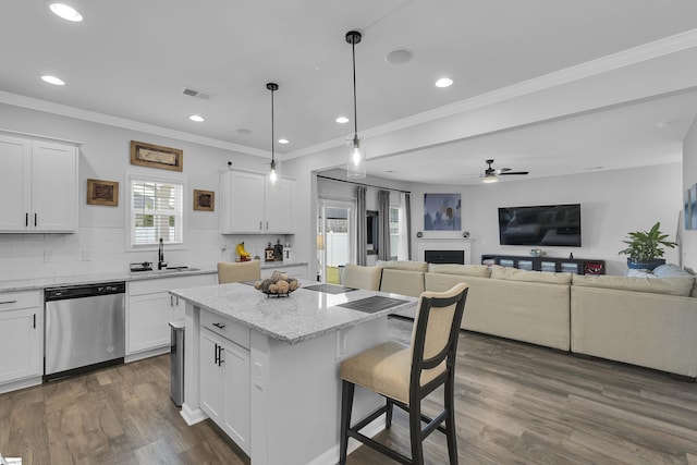 110 Strongridge Trl, Simpsonville, SC 29681 - kitchen with stainless steel dishwasher, a sink, a breakfast bar, a ceiling fan, and open floor plan