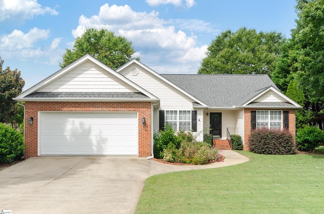 single story home with brick siding, driveway, a garage, and a front lawn