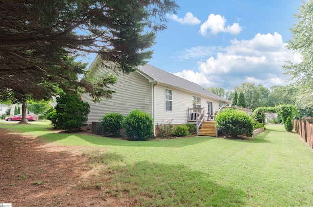 view of side of property featuring a wooden deck, central AC, and stairs