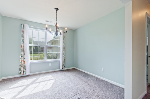 unfurnished dining area featuring a chandelier, carpet floors, and baseboards