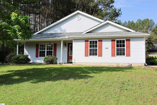 view of front of house featuring a front yard and roof with shingles