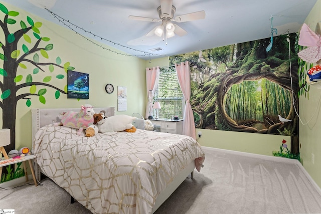 carpeted bedroom featuring a ceiling fan and baseboards