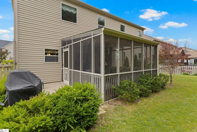 back of house with a sunroom