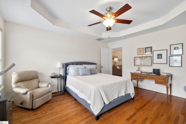 111 Woodvale Ave, Fountain Inn, SC 29644 - bedroom with a raised ceiling, wood finished floors, and ceiling fan
