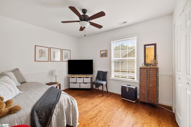 111 Woodvale Ave, Fountain Inn, SC 29644 - bedroom with light wood-type flooring, baseboards, ceiling fan, and a closet