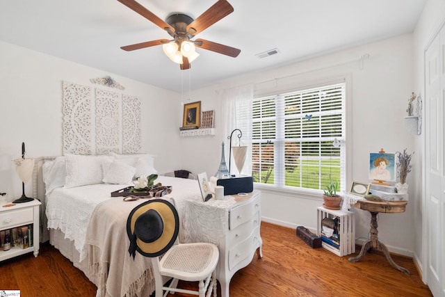 111 Woodvale Ave, Fountain Inn, SC 29644 - bedroom with wood finished floors, baseboards, a ceiling fan, and a closet