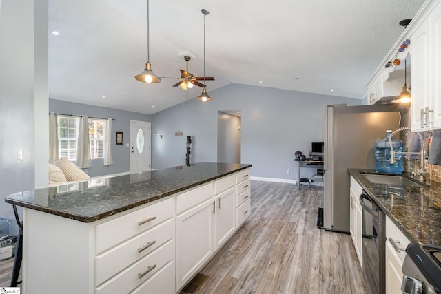 202 Forest Dr, Liberty, SC 29657 - kitchen featuring light wood-style flooring, range, vaulted ceiling, a ceiling fan, and a kitchen island