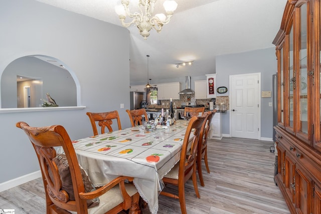 202 Forest Dr, Liberty, SC 29657 - dining space with a chandelier, light wood-style flooring, and baseboards