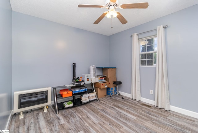 202 Forest Dr, Liberty, SC 29657 - miscellaneous room with wood finished floors, heating unit, baseboards, and ceiling fan