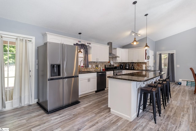 202 Forest Dr, Liberty, SC 29657 - kitchen with stainless steel appliances, a sink, white cabinetry, backsplash, and vaulted ceiling