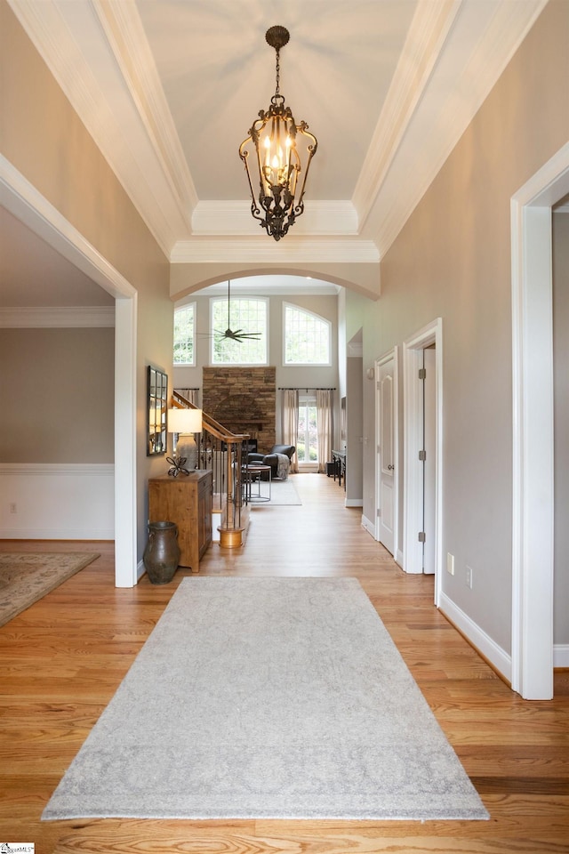5 Marlis Ct, Greer, SC 29650 - foyer with wood finished floors, a fireplace, crown molding, a chandelier, and baseboards