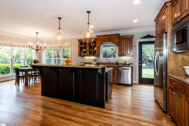 5 Marlis Ct, Greer, SC 29650 - kitchen featuring appliances with stainless steel finishes, dark stone countertops, a sink, a center island, and light wood-style flooring