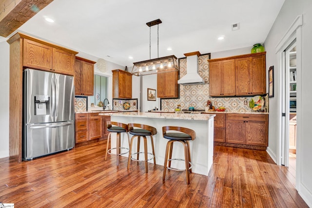 475 Johnson Rd, Easley, SC 29642 - kitchen featuring stainless steel fridge with ice dispenser, custom range hood, brown cabinets, a kitchen island, and dark wood-type flooring