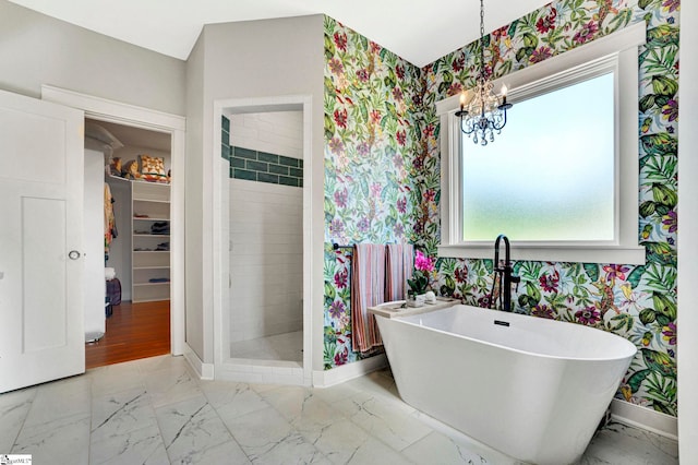 475 Johnson Rd, Easley, SC 29642 - bathroom with wallpapered walls, baseboards, marble look tiles, a chandelier, and a shower stall