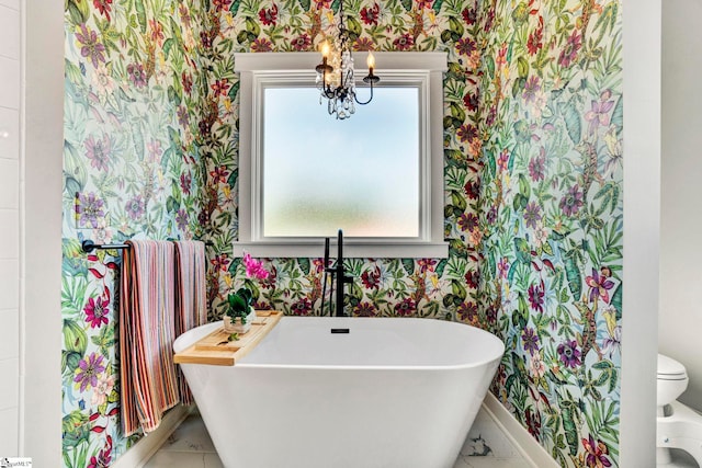 475 Johnson Rd, Easley, SC 29642 - bathroom with wallpapered walls, a soaking tub, baseboards, a sink, and a chandelier