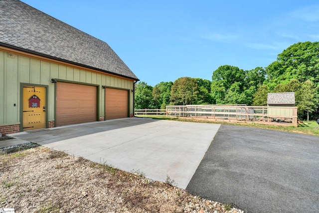 475 Johnson Rd, Easley, SC 29642 - garage featuring fence and a forest view