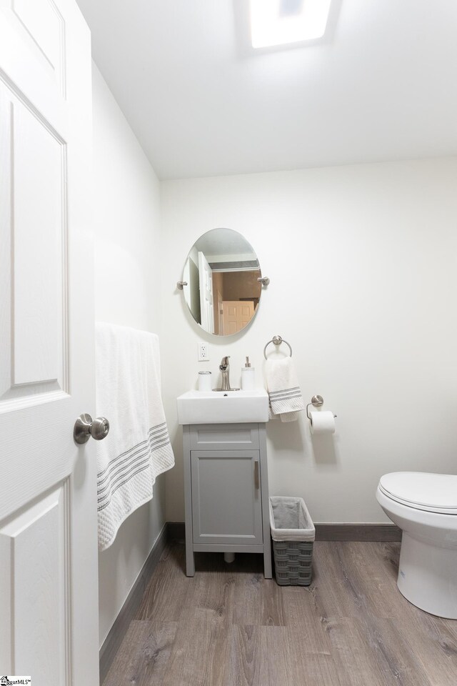 1230 Melton Rd Unit # 16, West Union, SC 29696 - half bath with wood finished floors, vanity, toilet, and baseboards
