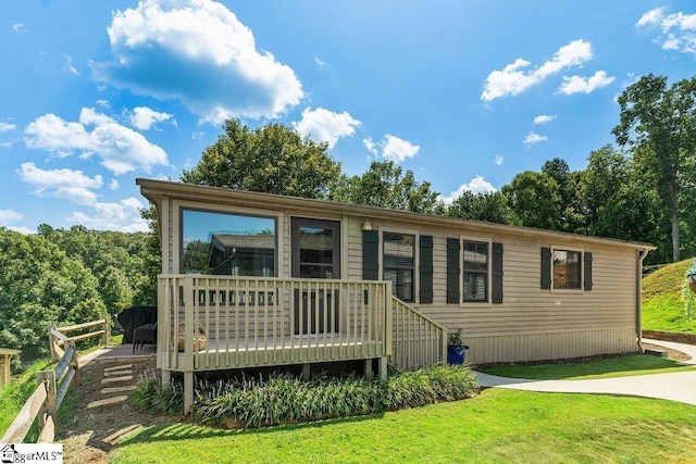 1230 Melton Rd Unit # 16, West Union, SC 29696 - view of front facade featuring a deck and a front yard