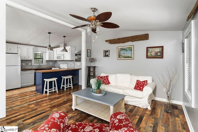 1230 Melton Rd Unit # 16, West Union, SC 29696 - living room featuring lofted ceiling, ceiling fan, dark wood-style flooring, and baseboards