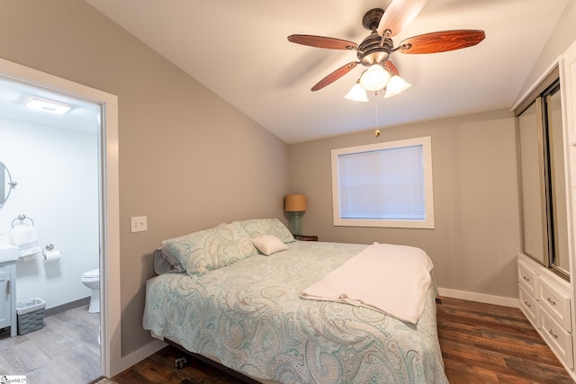 1230 Melton Rd Unit # 16, West Union, SC 29696 - bedroom with dark wood-style flooring, vaulted ceiling, baseboards, a ceiling fan, and ensuite bath