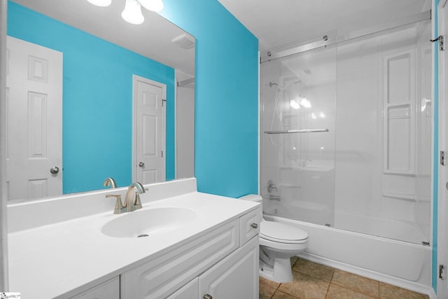 bathroom with toilet, vanity, washtub / shower combination, and tile patterned floors