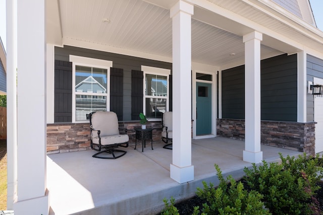 view of patio featuring a porch