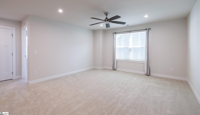 unfurnished room with recessed lighting, light carpet, ceiling fan, and baseboards