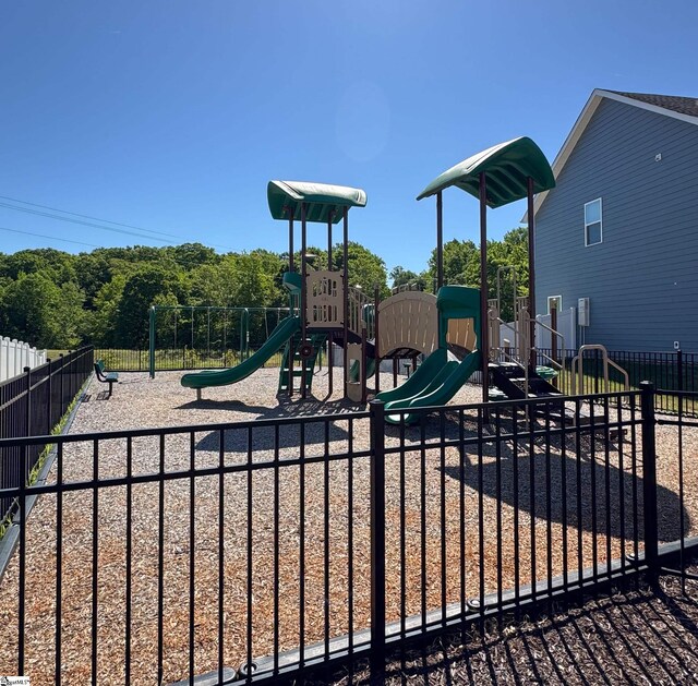 community jungle gym featuring fence