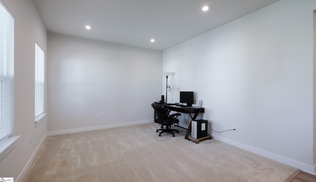 home office featuring light colored carpet, recessed lighting, and baseboards